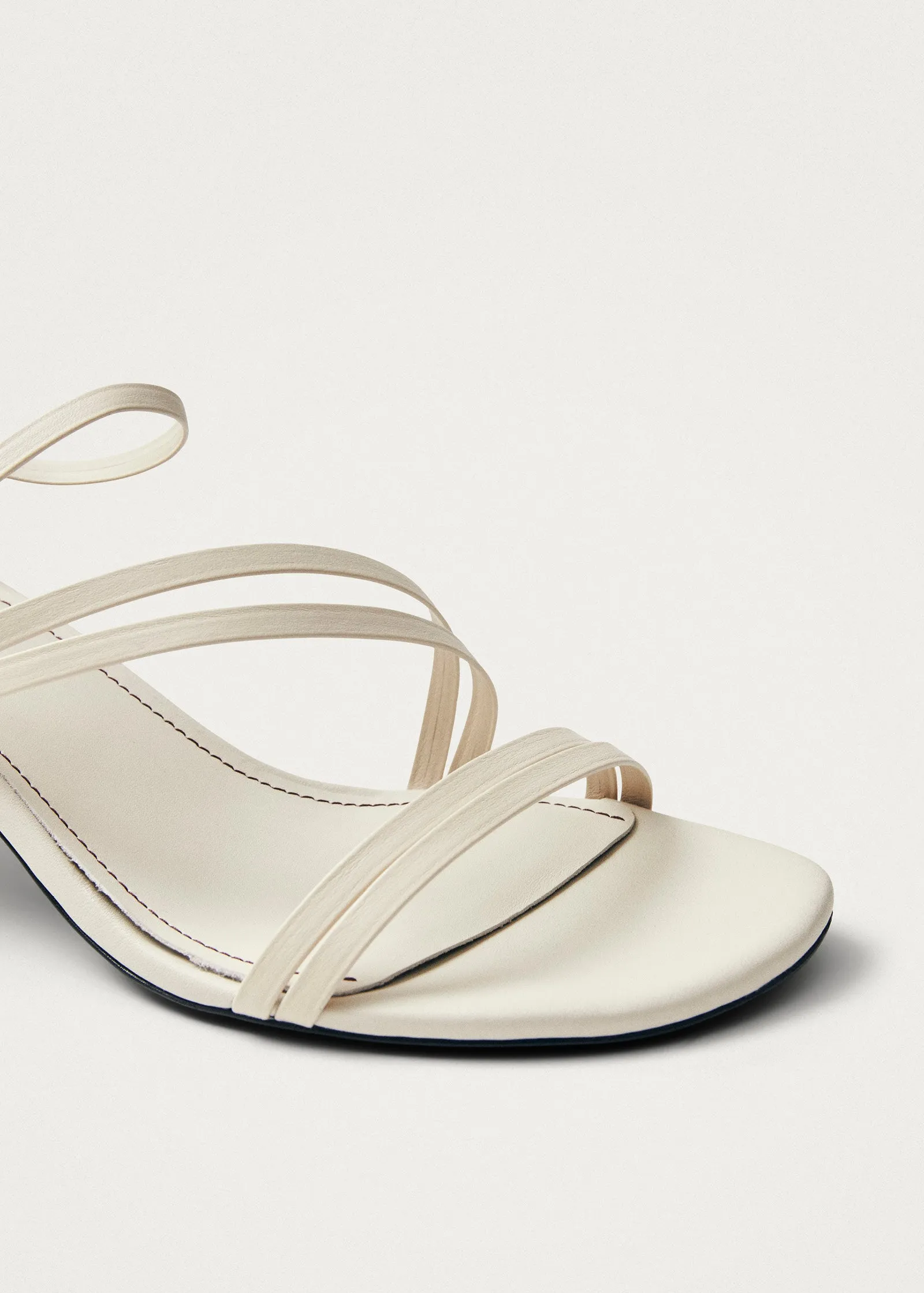Curly Cream Leather Sandals